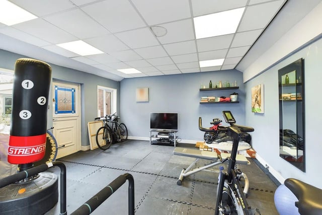 To the front of the property, there is a private driveway providing ample off-street parking that leads up to the garage which has been converted into a gym.