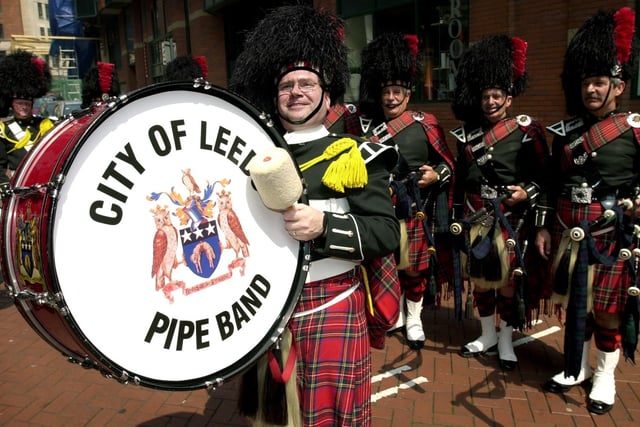 Bass drummer Mick Cullen leads the City of Leeds Pipe Band in the city centre on May 31, 2003.