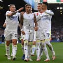 LEEDS, ENGLAND - NOVEMBER 07: Raphinha of Leeds United celebrates with team mates after scoring their sides first goal during the Premier League match between Leeds United and Leicester City at Elland Road on November 07, 2021 in Leeds, England. (Photo by Michael Regan/Getty Images)