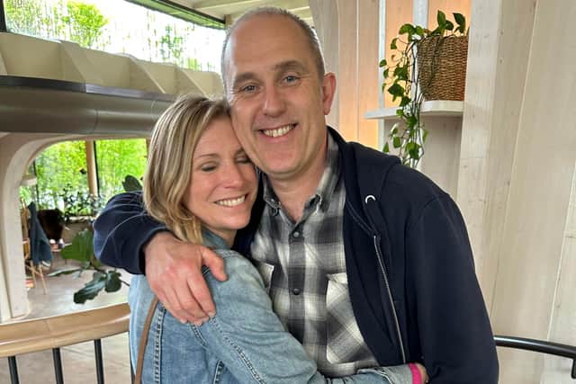 Natasha Loveridge, left, with her husband moments after finding out her tumours have reduced in considerable size.