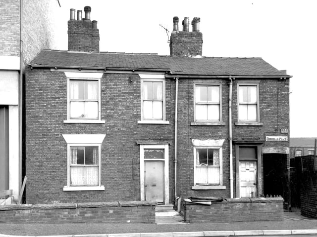 A pair of brickbuilt properties on Skinner Lane [pictured in September 1964. On the left is number 61 with number 63 following to the right. A passageway leading through to Boshell's Place is also visible.