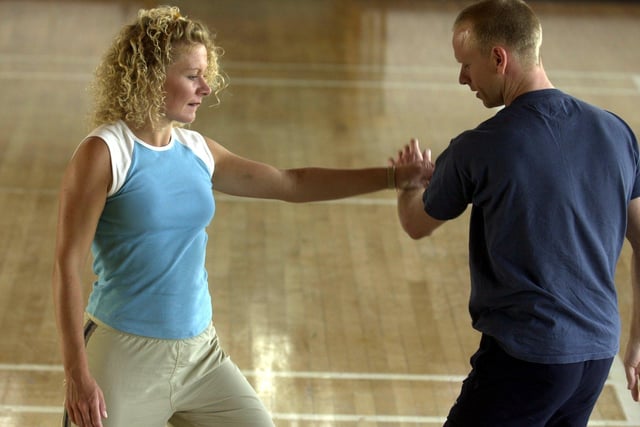 Actress Glenda Mackay, who featured on ITV's Emmerdale, exercises with Chinese physical culture instructor, Trevor Tiffany, at East Leeds Family Learning Centre, Seacroft, Leeds, in 2001.