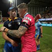 Rhinos coach Rohan Smith congratulates hat-trick hero Liam Sutcliffre after the play-off win at Catalans Dragons. Picture by Manuel Blondeau/SWpix.com.