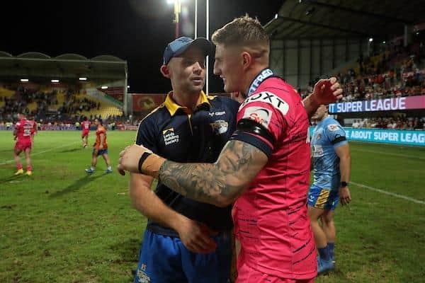 Rhinos coach Rohan Smith congratulates hat-trick hero Liam Sutcliffre after the play-off win at Catalans Dragons. Picture by Manuel Blondeau/SWpix.com.