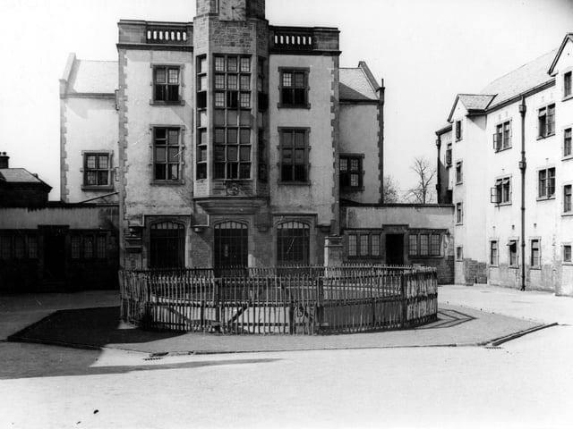 Circular static water supply tank in Cumberland Road. Behind is clear view of Devonshire Hall, hall of residence for the University of Leeds, built in 1928 in the 17th century 'Scottish Baronial' style. Pictured in April 1943.