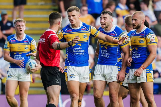 Leeds Rhinos' Ash Handley, Jake Connor and Jarrod O’Connor make a point to referee Jack Smith during the 6-0 loss to St Helens. Picture by Alex Whitehead/SWpix.com.