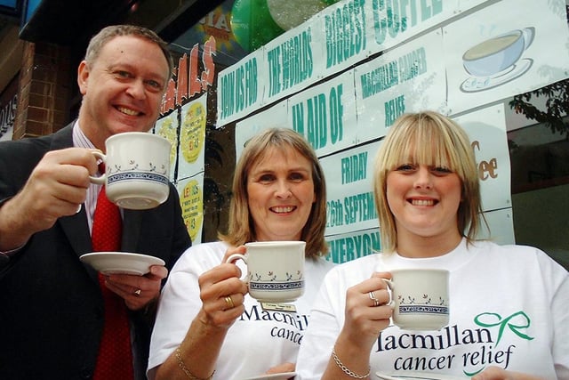 MP Paul Truswell dropped in to Althams Travel Agents to support their World's Biggest Coffee Morning event in September 2003.