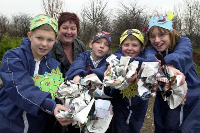 December 2003 and Hugh Gaitskell Primary School pupils were dressed as recycling warriors at the launch of Community Pride, an initiative which aimed to actively involve local people in tackling litter. Pictured, from left are James Mann, Joe Kelly, Tom Leak and Emily Jackson with Coun Angela Gabriel, chair of the community involvement team.
