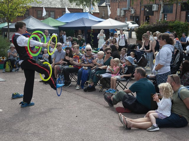 A crowd enjoy the circus skills