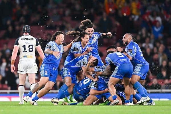 Samoa celebrate Stephen Crichton's winning drop goal. Picture by Will Palmer/SWpix.com.