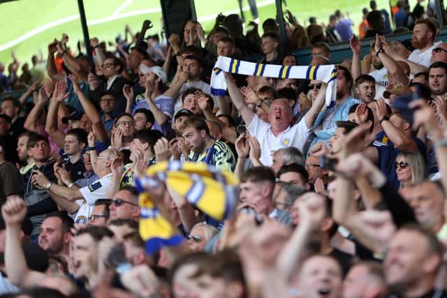 LEEDS, ENGLAND - AUGUST 21: Fans of Leeds United celebrate after their sides victory of the Premier League match between Leeds United and Chelsea FC at Elland Road on August 21, 2022 in Leeds, England. (Photo by Catherine Ivill/Getty Images)