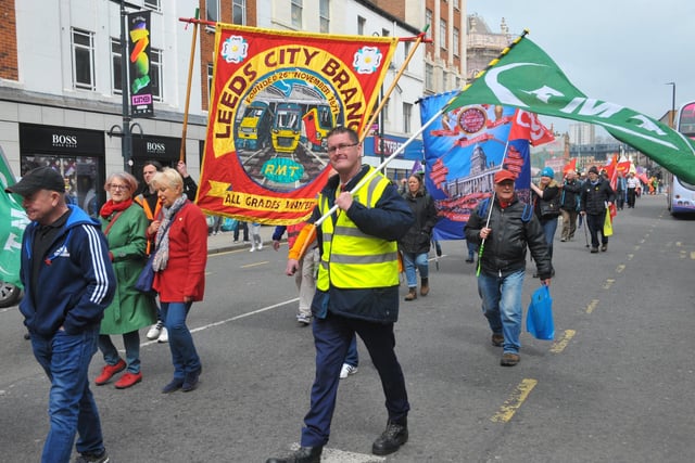 Marchers held colourful banners as they proceeded through Leeds city centre for the May Day March.