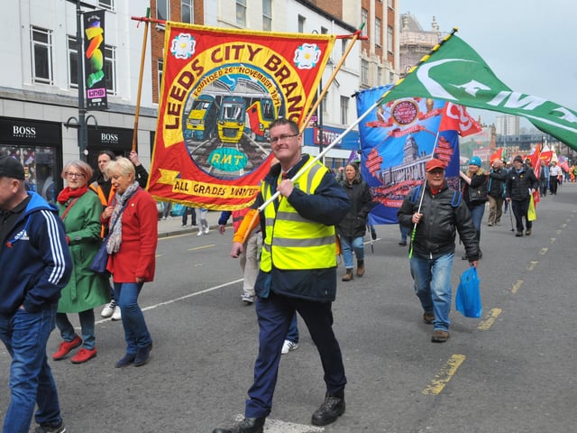 Marchers held colourful banners as they proceeded through Leeds city centre for the May Day March.