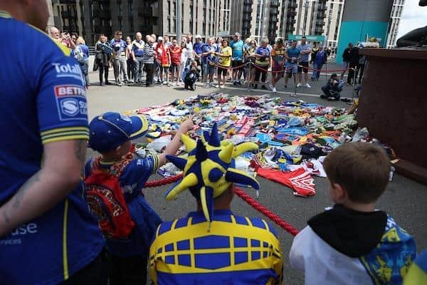 Fans from different clubs left tributes to Rob Burrow at a makeshift shrine next to Wembley's rugby league statue on Cup finals day. These have now been moved to Headingley.