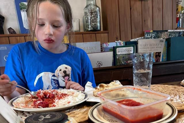 Isabelle enjoying a well-deserved curry after her mammoth climb