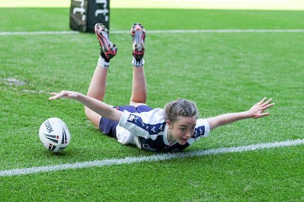 Lil Seal scores one of her four tries for Brooksbank School against Glantaf at St James's Park. Picture by Paul Currie/SWpix.com.