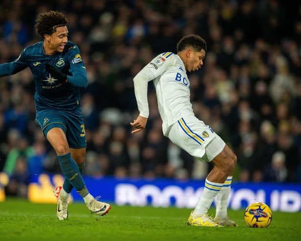 WAIT OVER: As Leeds United striker Georginio Rutter, right, brilliantly holds off Swansea City's Bashir Humphries, left, before coolly slotting home his first Whites goal scored at Elland Road. Photo by Bruce Rollinson.