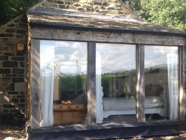 This private woodland cottage in Leeds has amazing views, a separate drive and parking for two cars.