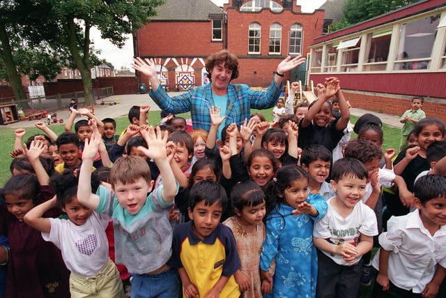 Margaret Malloy, headteacher at Hillcrest Primary in Chapeltown, celebrates with nursery children after the school was taken off the Government's register of failing schools. Pictured in July 1999.