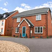 The property, on Royal Birkdale Way, benefits from a generous frontage, with a double driveway to the side alongside an additional gravelled parking area.
