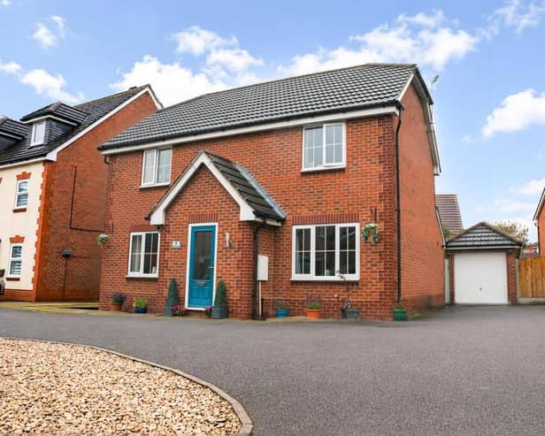 The property, on Royal Birkdale Way, benefits from a generous frontage, with a double driveway to the side alongside an additional gravelled parking area.