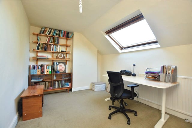 To the second floor are two attic style bedrooms - this one is being used as an office space.