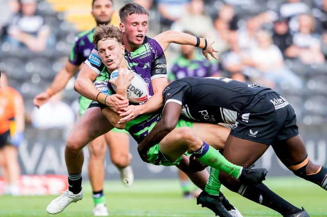 Jenson Windley (with ball) in action for Castleford Tigers against Hull FC last season. Picture by Allan McKenzie/SWpix.com.