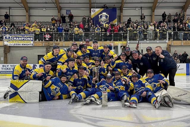 CHAMPIONS: Leeds Knights' players and staff pose with the NIHL National Champions trophy last Sunday at Elland Road Ice Arena. Picture courtesy of Leeds Knights.