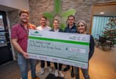 B&DWYW - 2 - The Technical team handing the cheque to Richard at St George's Crypt