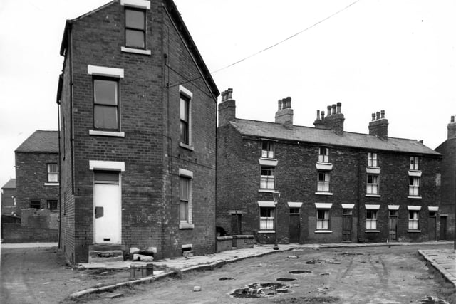 Bridges Place in April 1964. The house which can be seen in the left background is number 11 Lytton Road. The road in the bottom left corner is Cross Bridges Place. Number 16 Bridges Place is the house on the corner.