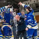 TRADITION: Head coach Ryan Aldridge gets a soaking from his players after their NIHL National play-off triumph. Picture: Miles Tidman/Knights Media