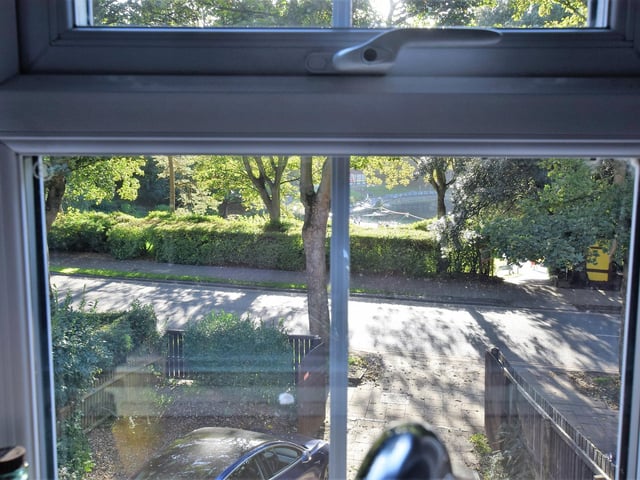 Looking out from a window within the property to leafy Peasholme Park