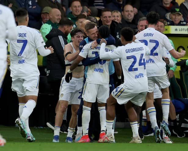DOUBLE DELIGHT: Crysencio Summerville, centre, is smothered as he celebrates scoring his second and Leeds United's third to seal a stunning comeback 3-2 victory at Saturday's Championship hosts Norwich City. Photo by George Tewkesbury/PA Wire.