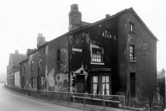 Looking down Burley Road in the direction of Park Lane and Leeds city centre in October 1959. In from the left are some advertising posters, then number 205, 207 Burley Road. Next is the corner with Olive Grove, number 1 is at the corner with the bay window, 3 is on the right.