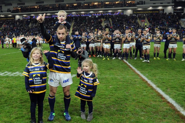 Rob Burrow, with children Macy, Maya and Jackson, thanks the South Stand after the game.