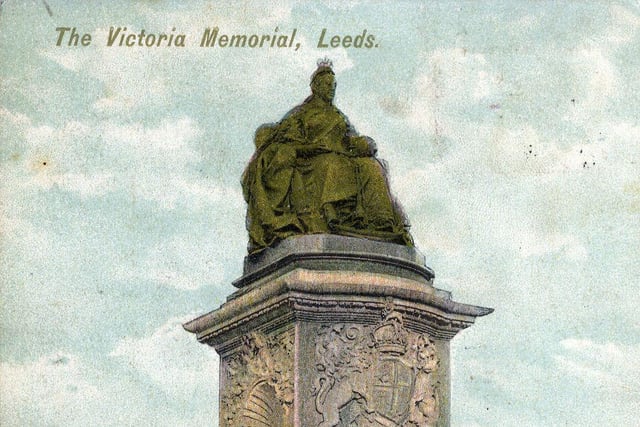 A colour tinted postcard dated August 1906 showing the Queen Victoria memorial statue sculpted by George Frampton which was unveiled the previous year. The queen herself is depicted sitting at the top of a pedestal in Coronation robes and crown.