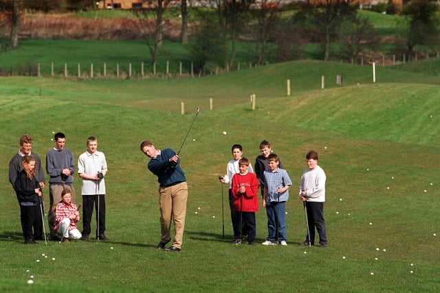 PGA pro Jason Wood teaches children the way to pitch at an open day for the Pearson Junior Golf Academy held at Cookridge Hall Golf Club in April 1997.