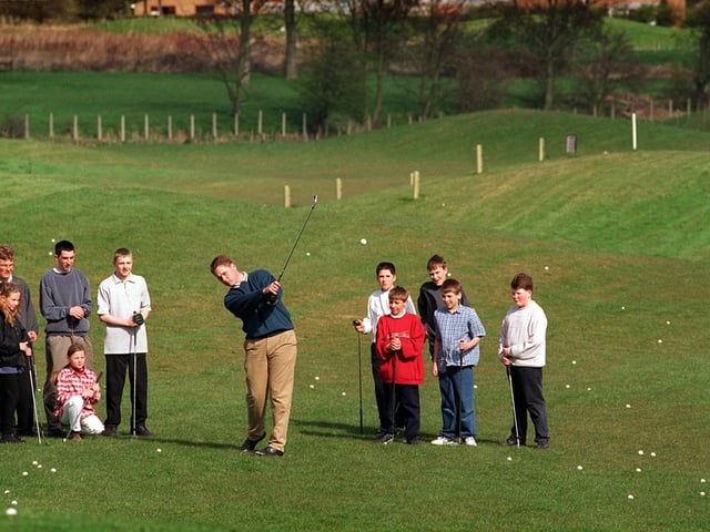 PGA pro Jason Wood teaches children the way to pitch at an open day for the Pearson Junior Golf Academy held at Cookridge Hall Golf Club in April 1997.