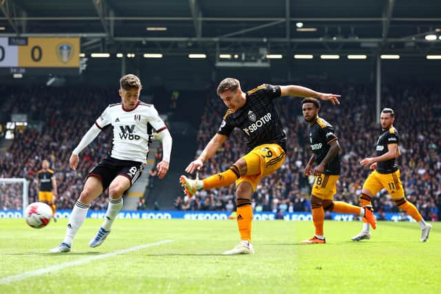 LONDON, ENGLAND - APRIL 22: Max Woeber of Leeds United shoots whilst under pressure from Harry Wilson of Fulham during the Premier League match between Fulham FC and Leeds United at Craven Cottage on April 22, 2023 in London, England. (Photo by Clive Rose/Getty Images)