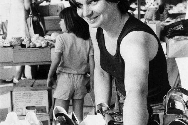 Do you remember Kirkgate Market trader Maria Chardman? Pictured at work on her shoe stall in August 1976.
