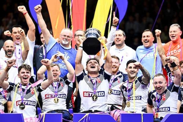 Leeds Rhinos' Tom Halliwell lifts the Wheelchair Rugby League World Cup after last year's victory over France. Picture by Will Palmer/SWpix.com.