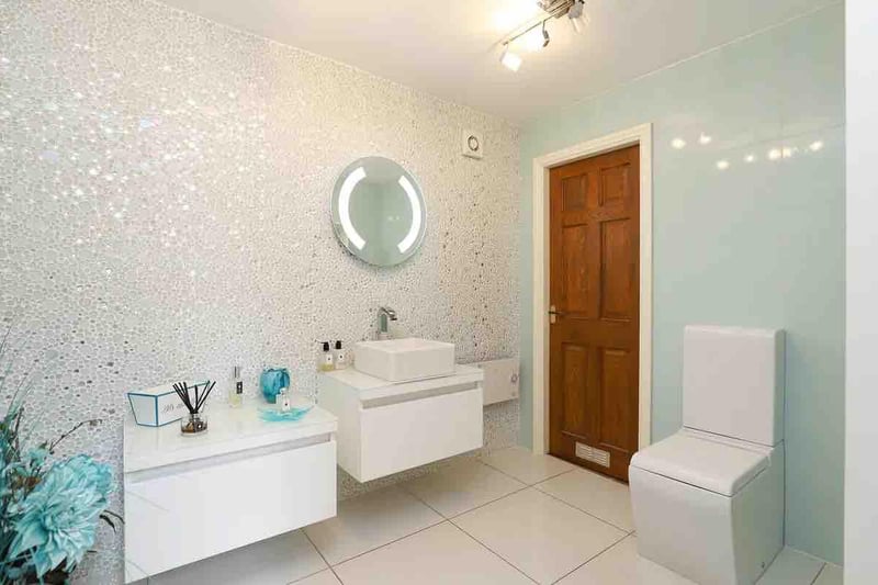 The downstairs bathroom is one of three in the property, perfect for family living.