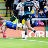 Harry Newman scores the first of his two tries in Leeds Rhinos' win against Leigh Leopards. Picture by Allan McKenzie/SWpix.com.