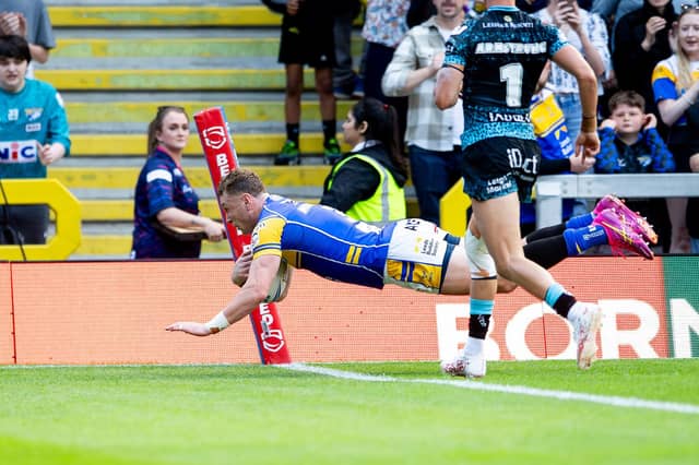 Harry Newman scores the first of his two tries in Leeds Rhinos' win against Leigh Leopards. Picture by Allan McKenzie/SWpix.com.