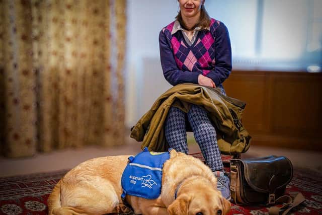 Molly Birch with support dog Chess, who has changed her life