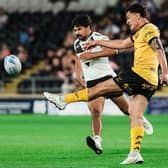 Daejarn Asi gets a kick away during Castleford Tigers' win at Hull last week, which will send them into Saturday's game at St Helens in good heart according to rugby director Chris Chester. Picture by Alex Whitehead/SWpix.com.