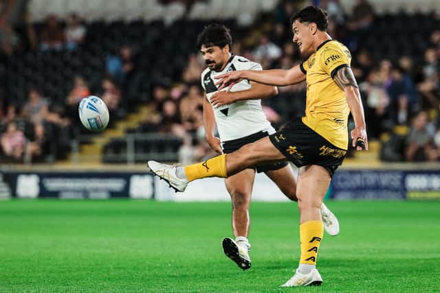 Daejarn Asi gets a kick away during Castleford Tigers' win at Hull last week, which will send them into Saturday's game at St Helens in good heart according to rugby director Chris Chester. Picture by Alex Whitehead/SWpix.com.