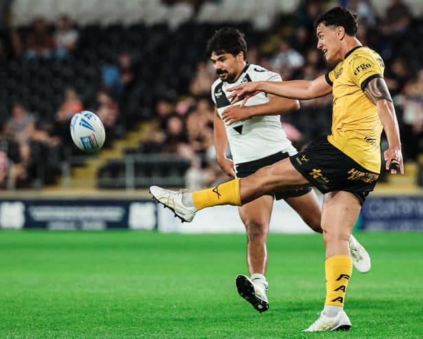 Daejarn Asi gets a kick away during Castleford Tigers' win at Hull last week, which will send them into Saturday's game at St Helens in good heart according to rugby director Chris Chester. Picture by Alex Whitehead/SWpix.com.