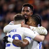 CHALLENGE: Issued to Leeds United left back Junior Firpo, top, pictured celebrating with goalscorers Crysencio Summerville, right, and Dan James, left, after Summerville's strike in the 3-0 victory against Championship visitors Birmingham City on New Year's Day. Photo by George Wood/Getty Images.