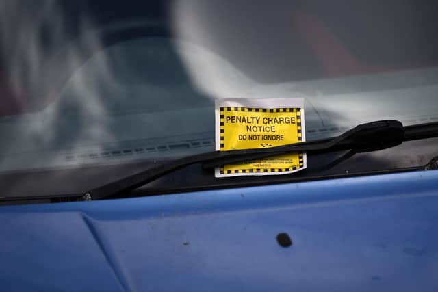 Parking ticket on a windscreen.